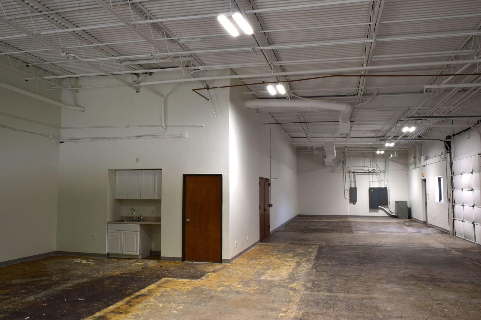 Open warehouse commercial make-ready space with exposed ceiling, Austin, TX